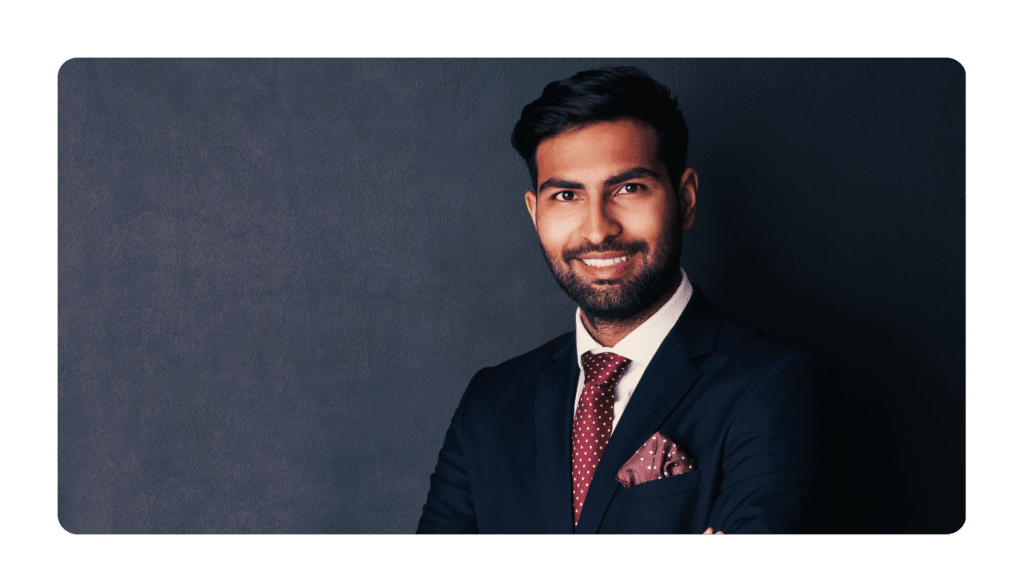 A man in a suit demonstrating that how you show up is part of answering the question, "what is executive presence?"