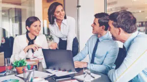 Smiling leadership team at a Midwest manufacturing firm