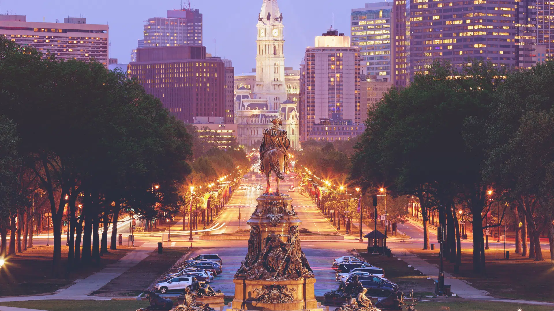 view of statue of Paul Revere with Philadelphia skyline in the background