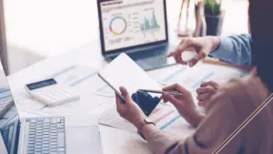 close up of hands doing accounting work