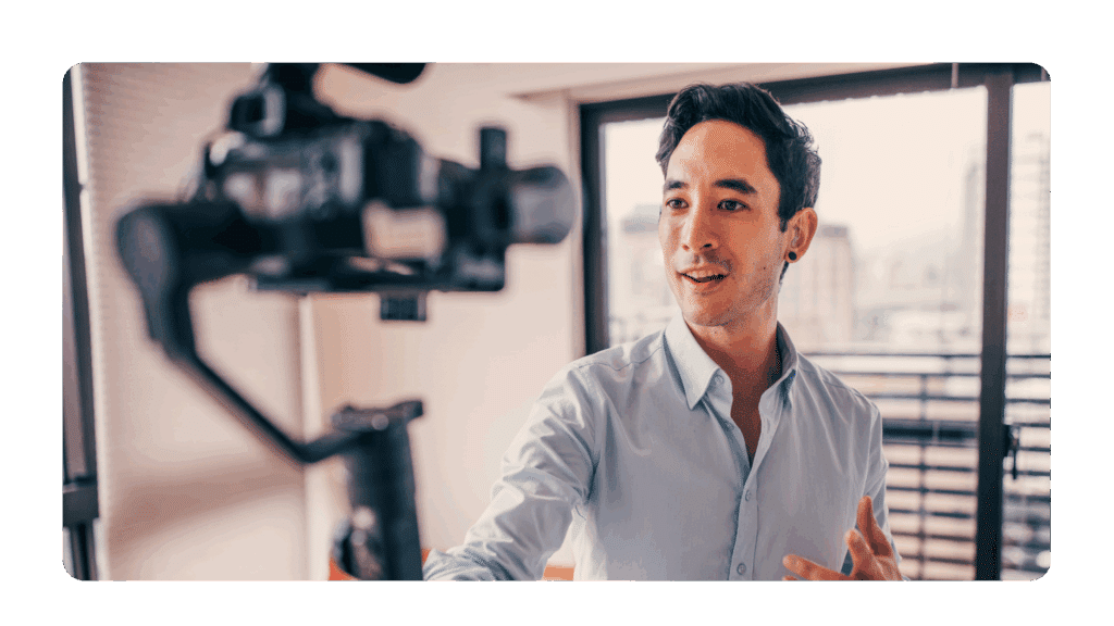 leader with good executive presence on camera speaking into a video recorder