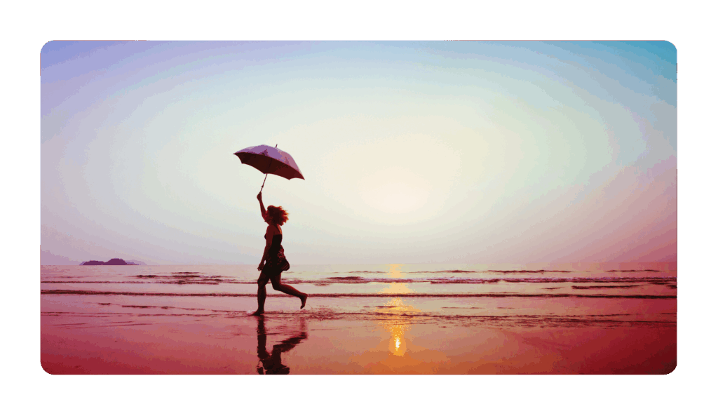 person running on the beach with an umbrella to represent using your imagination to stay relevant at work