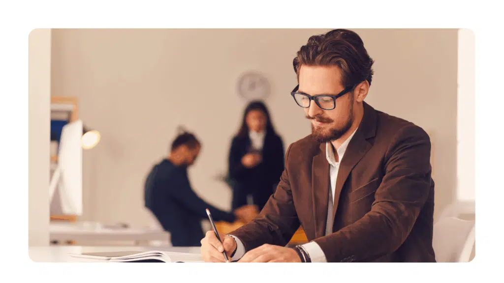 man working on determining objectives for upcoming strategic planning offsite
