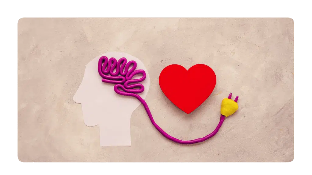 An image of a brain plugged into a heart shape representing a key leadership lesson from the c-suite to develop emotional intelligence.