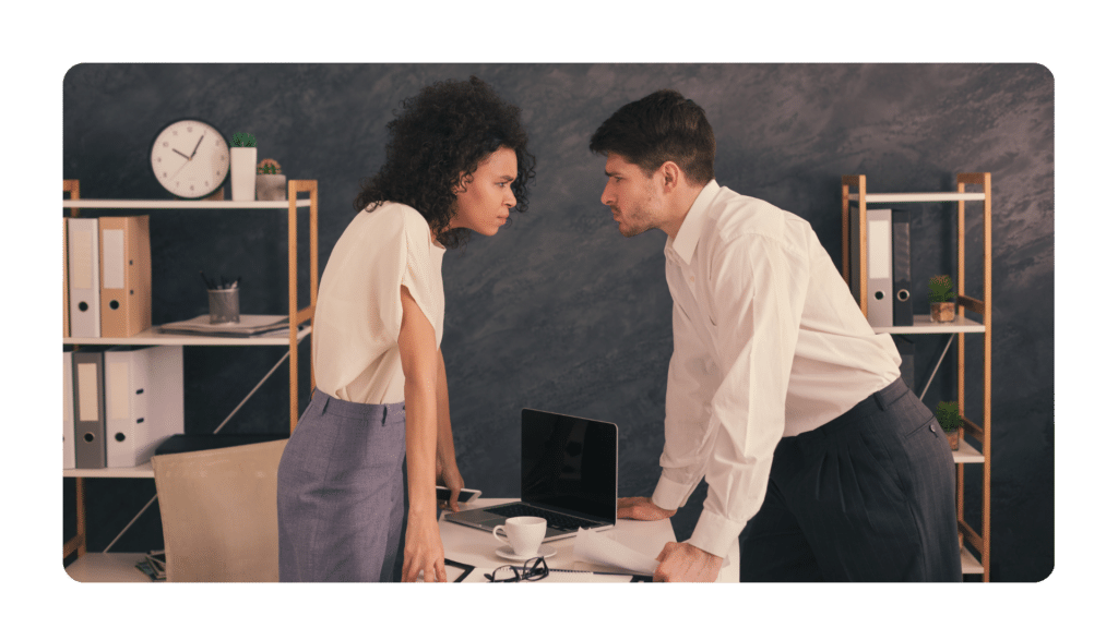 two employees staring each other down clearly in need of a manager with conflict management skills