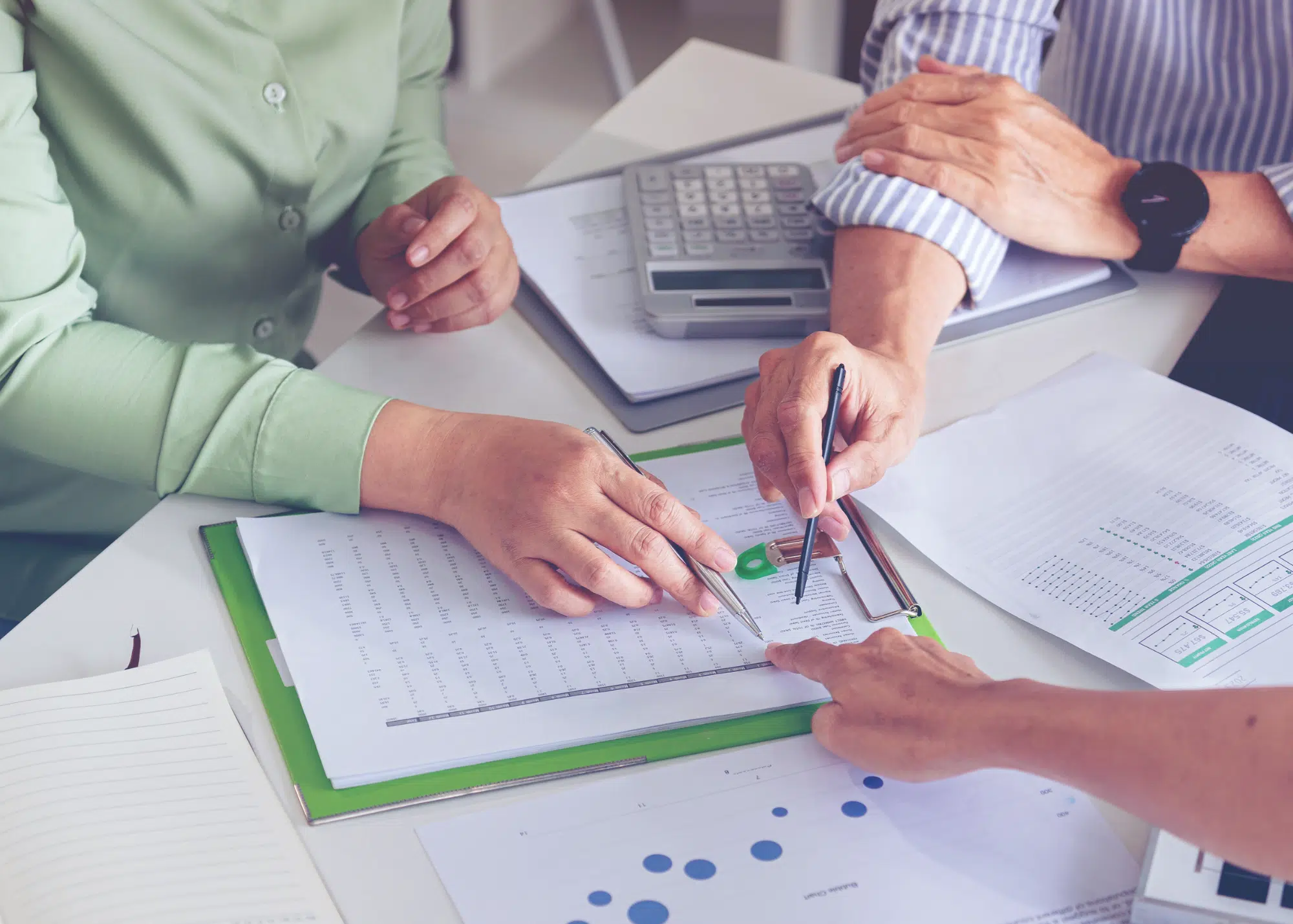 members of sector specific private equity fund working at table